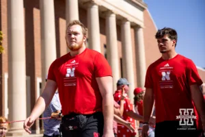 Nebraska Cornhusker offensive lineman Gunnar Gottula walks with Heinrich Haarberg before taking on the Rutgers Scarlet Knights during a college football game Saturday, October 5, 2024, in Lincoln, Nebraska. Photo by John S. Peterson.