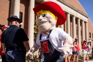 Herbie Husker running along the Legacy Walk before taking on Rutgers Scarlet Knights during a college football game Saturday, October 5, 2024, in Lincoln, Nebraska. Photo by John S. Peterson.