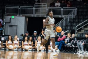 Omaha MavericksJJ White brings the ball up court during a college basketball game on November 30th, 2024 in Omaha Nebraska. Photo by Brandon Tiedemann.