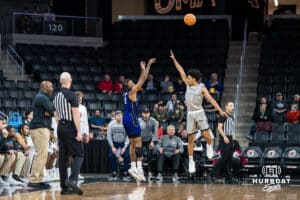 Omaha Mavericks Lance Waddles contests a shot during a college basketball game on November 30th, 2024 in Omaha Nebraska. Photo by Brandon Tiedemann.