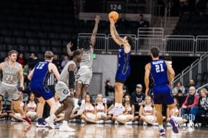 Omaha Mavericks JJ White contests a shot during a college basketball game on November 30th, 2024 in Omaha Nebraska.Photo by Brandon Tiedemann.