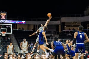 Omaha Mavericks Marquel Sutton jumps during tipoff during a college basketball game on November 30th, 2024 in Omaha Nebraska. Photo by Brandon Tiedemann.
