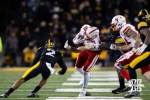 Nebraska Cornhuskers wide receiver Carter Nelson (29) runs with the ball against Iowa Hawkeyes defensive back TJ Hall (2) and defensive lineman Deontae Craig (45) during a college football game Friday, November 29, 2024, in Iowa City, Iowa. Photo by John S. Peterson.