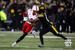 Nebraska Cornhuskers wide receiver Jahmal Banks (4) runs with the ball against Iowa Hawkeyes defensive back Deshaun Lee (8) during a college football game Friday, November 29, 2024, in Iowa City, Iowa. Photo by John S. Peterson.