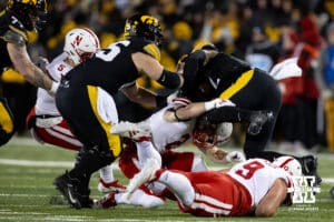Nebraska Cornhuskers defensive back Isaac Gifford (2) tackles Iowa Hawkeyes running back Kaleb Johnson (2) during a college football game Friday, November 29, 2024, in Iowa City, Iowa. Photo by John S. Peterson.