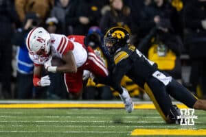 Nebraska Cornhuskers wide receiver Jahmal Banks (4) runs with the ball against Iowa Hawkeyes defensive back TJ Hall (2) during a college football game Friday, November 29, 2024, in Iowa City, Iowa. Photo by John S. Peterson.