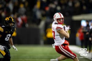 Nebraska Cornhuskers tight end Nate Boerkircher (87) makes a catch against Iowa Hawkeyes defensive back Deshaun Lee (8) in the first quarter during a college football game Friday, November 29, 2024, in Iowa City, Iowa. Photo by John S. Peterson.