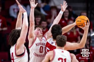 Nebraska Cornhuskers guard Connor Essegian (0) and center Braxton Meah (34) defend the basket against South Dakota Coyotes guard Porter Ihnen (5) in the second half during a college basketball game Wednesday, November 27, 2024, in Lincoln, Nebraska. Photo by John S. Peterson.