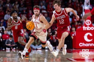 Nebraska Cornhuskers guard Sam Hoiberg (1) dribbels the ball against South Dakota Coyotes guard Isaac Bruns (12) in the second half during a college basketball game Wednesday, November 27, 2024, in Lincoln, Nebraska. Photo by John S. Peterson.