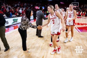 Nebraska Cornhuskers guard Allison Weidner (3) gets five from head coach Amy Williams after the win over the UMKC Roos during a college women’s basketball game Tuesday, November 26, 2024, in Lincoln, Nebraska. Photo by John S. Peterson.