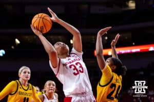 Nebraska Cornhuskers guard Amiah Hargrove (33) makes a layup against UMKC Roos guard Zaire Harrell (24) in the second half during a college women’s basketball game Tuesday, November 26, 2024, in Lincoln, Nebraska. Photo by John S. Peterson.
