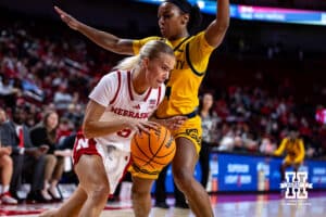 Nebraska Cornhuskers guard Alberte Rimdal (5) drives the baseline against UMKC Roos guard Zaire Harrell (24) in the third quarter during a college women’s basketball game Tuesday, November 26, 2024, in Lincoln, Nebraska. Photo by John S. Peterson.