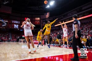 Nebraska Cornhuskers guard Callin Hake (14) makes a three-point shot from the corner against UMKC Roos center Chloe Dallas (20) in the second quarter during a college women’s basketball game Tuesday, November 26, 2024, in Lincoln, Nebraska. Photo by John S. Peterson.