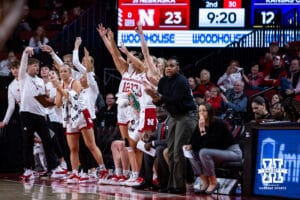 Nebraska Cornhuskers bench celebrates a three-point shot by Alberte Rimdal against the UMKC Roos in the second quarter during a college women’s basketball game Tuesday, November 26, 2024, in Lincoln, Nebraska. Photo by John S. Peterson.
