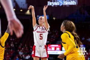 Nebraska Cornhuskers guard Alberte Rimdal (5) makes a three-point shot against UMKC Roos guard Emani Bennett (0) in the first half during a college women’s basketball game Tuesday, November 26, 2024, in Lincoln, Nebraska. Photo by John S. Peterson.