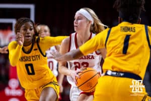 Nebraska Cornhuskers guard Britt Prince (23) drives to the basket against UMKC Roos guard Emani Bennett (0) and guard Nikole Thomas (1) in the first half during a college women’s basketball game Tuesday, November 26, 2024, in Lincoln, Nebraska. Photo by John S. Peterson.