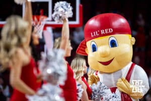 Nebraska Cornhuskers mascot Lil'Red hanging out with the Scarlets at a break in the action against the UMKC Roos during a college women’s basketball game Tuesday, November 26, 2024, in Lincoln, Nebraska. Photo by John S. Peterson.