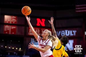 Nebraska Cornhuskers guard Alberte Rimdal (5) makes a layup against UMKC Roos guard Nikole Thomas (1) in the first half during a college women’s basketball game Tuesday, November 26, 2024, in Lincoln, Nebraska. Photo by John S. Peterson.