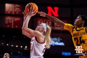 Nebraska Cornhuskers guard Britt Prince (23) makes a layup against UMKC Roos guard Zaire Harrell (24) in the first quarter during a college women’s basketball game Tuesday, November 26, 2024, in Lincoln, Nebraska. Photo by John S. Peterson.