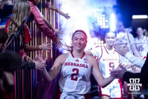 Nebraska Cornhuskers guard Logan Nissley (2) leads the Huskers out on to the court to take on the UMKC Roos during a college women’s basketball game Tuesday, November 26, 2024, in Lincoln, Nebraska. Photo by John S. Peterson.