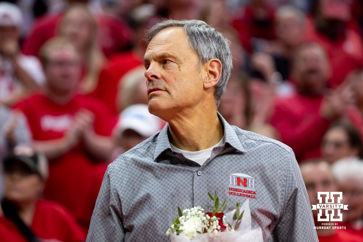 Nebraska Volleyball v Wisconsin November 23, 2024. Nebraska Cornhusker head coach John Cook waiting honor the seniors after a college volleyball match Wisconsin Badgers Saturday, November 23, 2024 in Lincoln, Nebraska. Photo by John S. Peterson.