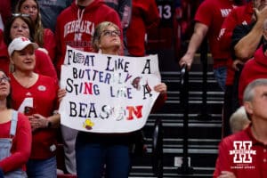Nebraska Cornhusker fans holding a sign after a college volleyball match against the Wisconsin Badgers Saturday, November 23, 2024 in Lincoln, Nebraska. Photo by John S. Peterson.