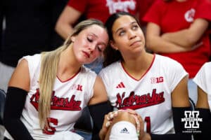 Nebraska Cornhusker Laney Choboy (6) emotional leans against Skyler Pierce (21) before Senior Night begins after a college volleyball match against the Wisconsin Badgers Saturday, November 23, 2024 in Lincoln, Nebraska. Photo by John S. Peterson.