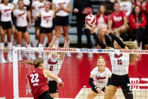 Nebraska Cornhusker middle blocker Andi Jackson (15) blocks a spike from Wisconsin Badger libero Julia Orzol (22) in the second set during a college volleyball match Saturday, November 23, 2024 in Lincoln, Nebraska. Photo by John S. Peterson.
