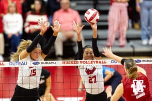Nebraska Cornhusker outside hitter Harper Murray (27) blocks the ball against Wisconsin Badger opposite Anna Smrek (14) in the second set during a college volleyball match Saturday, November 23, 2024 in Lincoln, Nebraska. Photo by John S. Peterson.