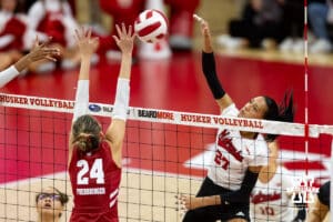 Nebraska Cornhusker outside hitter Harper Murray (27) spikes the ball against Wisconsin Badger setter Charlie Fuerbringer (24) in the first set during a college volleyball match Saturday, November 23, 2024 in Lincoln, Nebraska. Photo by John S. Peterson.