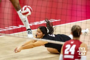 Nebraska Cornhusker libero Lexi Rodriguez (8) digs the ball against the Wisconsin Badgers during a college volleyball match Saturday, November 23, 2024 in Lincoln, Nebraska. Photo by John S. Peterson.
