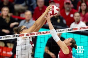 Nebraska Cornhusker middle blocker Rebekah Allick (5) battles Wisconsin Badger setter Charlie Fuerbringer (24) at the net in the fifrst set during a college volleyball match Saturday, November 23, 2024 in Lincoln, Nebraska. Photo by John S. Peterson.