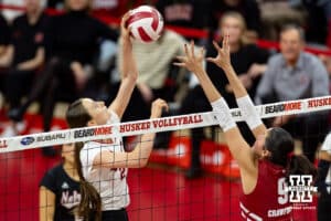 Nebraska Cornhusker setter Bergen Reilly (2) spikes the ball against Wisconsin Badger middle blocker CC Crawford (9) in the first set during a college volleyball match Saturday, November 23, 2024 in Lincoln, Nebraska. Photo by John S. Peterson.