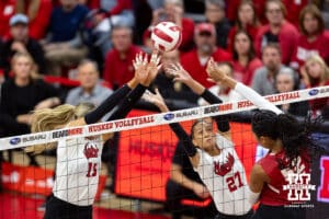 Nebraska Cornhusker Andi Jackson (15) and Harper Murray (27) blocks the ball against the Wisconsin Badgers during a college volleyball match Saturday, November 23, 2024 in Lincoln, Nebraska. Photo by John S. Peterson.