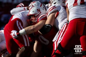Nebraska Cornhusker defensive lineman Nash Hutmacher (0) makes a tackle against the Wisconsin Badgers during a college football game Saturday, November 23, 2024 in Lincoln, Nebraska. Photo by John S. Peterson.