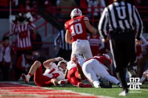 Nebraska Cornhusker quarterback Heinrich Haarberg (10) runs in for a touchdown against the Wisconsin Badgers in the first quarter during a college football game Saturday, November 23, 2024 in Lincoln, Nebraska. Photo by John S. Peterson.