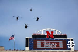 Military helcopters three Blackhawks and one chinook flyover before the college football game between the Nebraska Cornhuskers and the Wisconsin Badgers Saturday, November 23, 2024 in Lincoln, Nebraska. Photo by John S. Peterson.