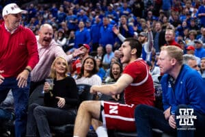 Nebraska Cornhusker forward Berke Buyuktuncel (9) goes out of bounds and end up in a court side seat against the Creighton Bluejays in the second half during a college basketball game Friday, November 22, 2024 in Omaha, Nebraska. Photo by John S. Peterson.
