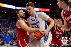 Nebraska Cornhusker guard Rollie Worster (24) and Creighton Bluejay center Ryan Kalkbrenner (11) fight for a rebound during a college basketball game Friday, November 22, 2024 in Omaha, Nebraska. Photo by John S. Peterson.