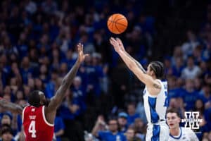 Creighton Bluejay guard Pop Isaacs (2) makes a three point shot against Nebraska Cornhusker forward Juwan Gary (4) in the first half during a college basketball game Friday, November 22, 2024 in Omaha, Nebraska. Photo by John S. Peterson.
