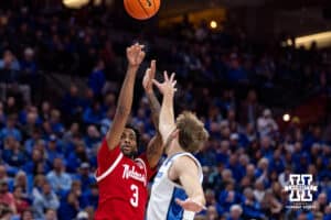 Nebraska Cornhusker guard Brice Williams (3) makes a three point shot against Creighton Bluejay forward Isaac Traudt (41) in the first half during a college basketball game Friday, November 22, 2024 in Omaha, Nebraska. Photo by John S. Peterson.
