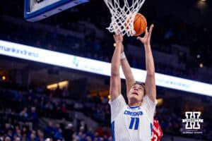 Creighton Bluejay center Ryan Kalkbrenner (11) grabs a rebound against the Nebraska Cornhuskers in the first half during a college basketball game Friday, November 22, 2024 in Omaha, Nebraska. Photo by John S. Peterson.
