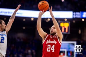Nebraska Cornhusker guard Rollie Worster (24) makes a jump shot against Creighton Bluejay guard Pop Isaacs (2) in the first half during a college basketball game Friday, November 22, 2024 in Omaha, Nebraska. Photo by John S. Peterson.