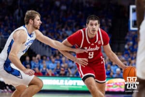 Nebraska Cornhusker forward Berke Buyuktuncel (9) dribbles the ball against Creighton Bluejay forward Isaac Traudt (41) during a college basketball game Friday, November 22, 2024 in Omaha, Nebraska. Photo by John S. Peterson.