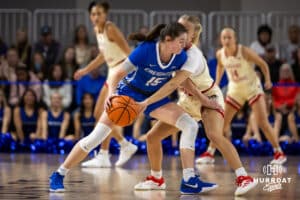 Nebraska Cornhusker guard Alberte Rimdal (5) reaches for the ball against Creighton Bluejay guard Lauren Jensen (15) in the second half during a women’s college basketball game Friday, November 22, 2024 in Omaha, Nebraska. Photo by John S. Peterson.