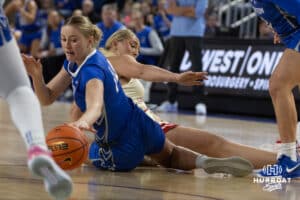 Creighton Bluejay forward Mallory Brake (14) grabs the loose ball against the Nebraska Cornhuskers in the second half during a women’s college basketball game Friday, November 22, 2024 in Omaha, Nebraska. Photo by John S. Peterson.