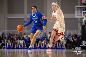 Creighton Bluejay guard Kiani Lockett (11) dribbles the ball against Nebraska Cornhuskers in the first half during a women’s college basketball game Friday, November 22, 2024 in Omaha, Nebraska. Photo by John S. Peterson.