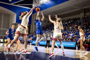 Creighton Bluejay guard Lauren Jensen (15) makes a jump shot against the Nebraska Cornhuskers in the first half during a women’s college basketball game Friday, November 22, 2024 in Omaha, Nebraska. Photo by John S. Peterson.