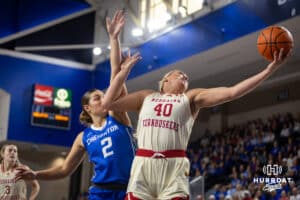 Nebraska Cornhusker center Alexis Markowski (40) reaches for the rebound against Creighton Bluejay guard Kennedy Townsend (2) in the first half during a women’s college basketball game Friday, November 22, 2024 in Omaha, Nebraska. Photo by John S. Peterson.