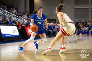 Creighton Bluejay guard Lauren Jensen (15) dribbles the ball against Nebraska Cornhusker guard Callin Hake (14) in the first half during a women’s college basketball game Friday, November 22, 2024 in Omaha, Nebraska. Photo by John S. Peterson.